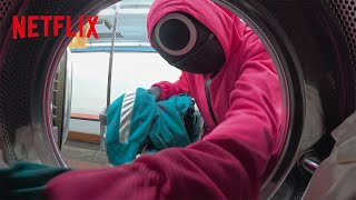 Squid Game Pink Guards Spotted At A Local Laundromat | Netflix